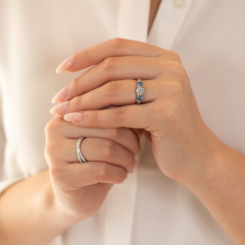 Hands together with rings that have beed resized and sized