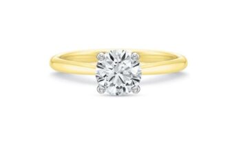 0.71ct round diamond solitaire engagement ring in 18K yellow gold and platinum, prong setting