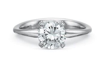 Diamond Silk Engagement Ring in platinum featuring a 0.74-carat round center diamond with side melee diamonds