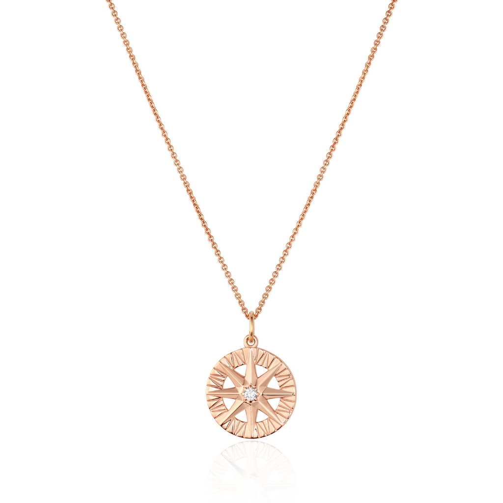 Round diamond compass rose pendant in warm 14K rose gold with bead-set accents