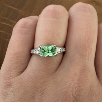 Mint green radiant cut tourmaline ring set in platinum with radiant cut diamond accents