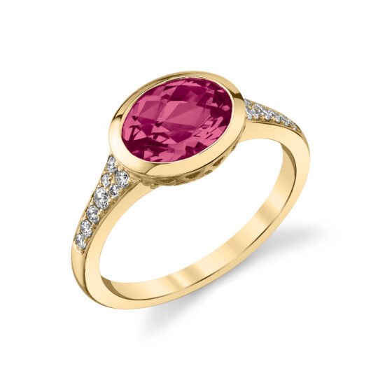 Magenta garnet ring with oval center gem and 16 diamonds set in 14K yellow gold, finger size 7