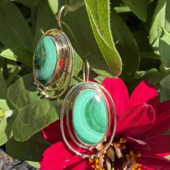 Oval green malachite earrings with diamond accents set in 14K yellow gold, French wire style