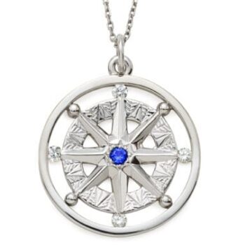 Compass Rose pendant in 14K white gold featuring a round blue sapphire center and four round brilliant diamonds at compass points