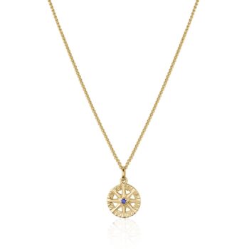 Compass Rose pendant in 14K yellow gold featuring a round blue sapphire gemstone