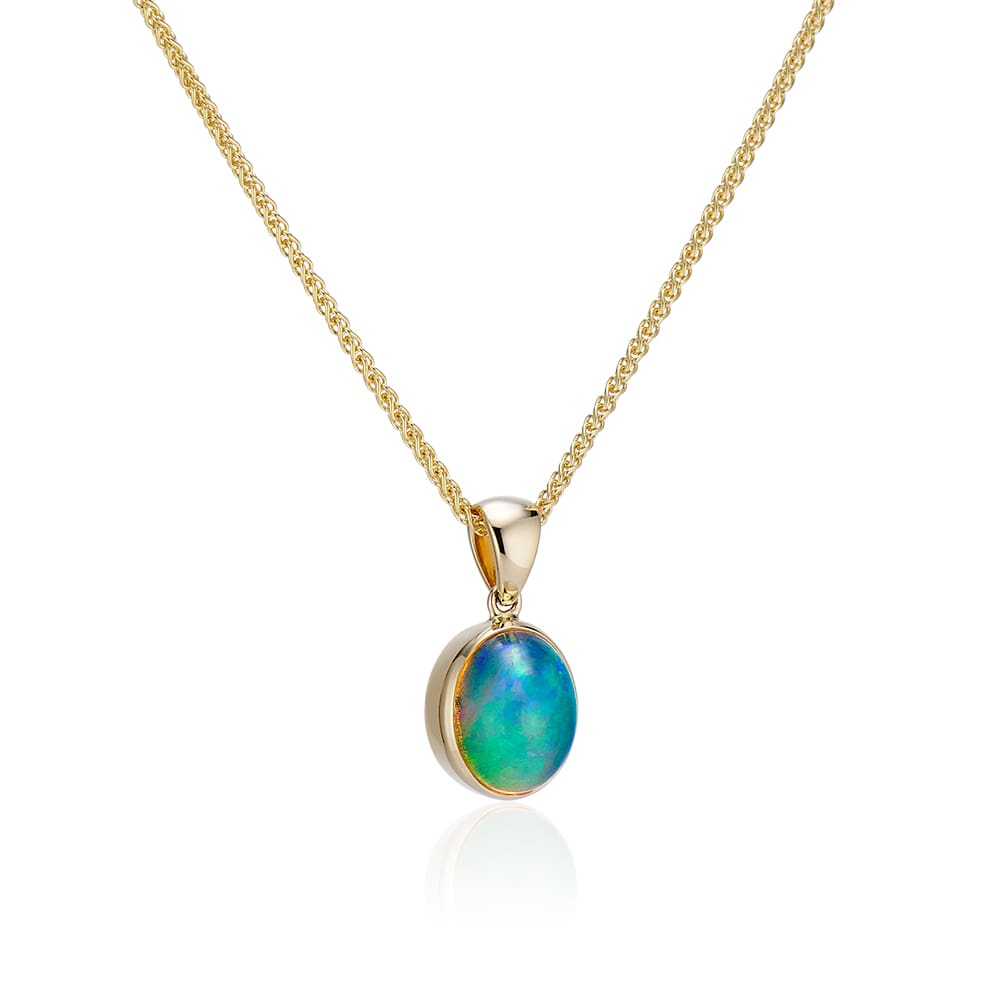 Oval Ethiopian opal pendant set in 14K yellow gold