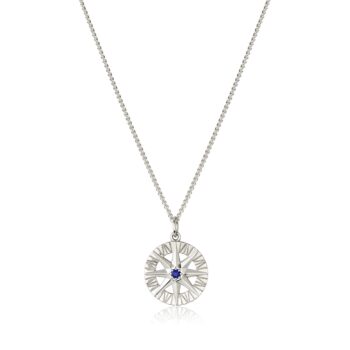 Compass Rose pendant featuring a round blue sapphire set in 14K white gold