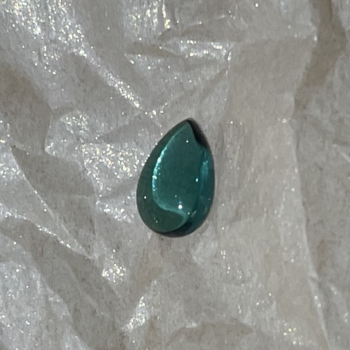 Pear shaped 1.26 carat green tourmaline cabochon with smooth polished surface