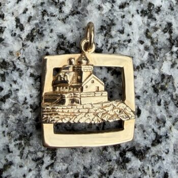 Lighthouse pendant crafted in polished 14K yellow gold with a sleek silhouette