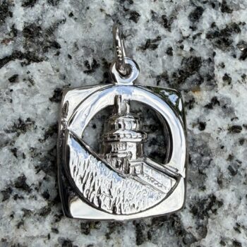 Sterling silver charm depicting Owls Head Lighthouse in detailed miniature form