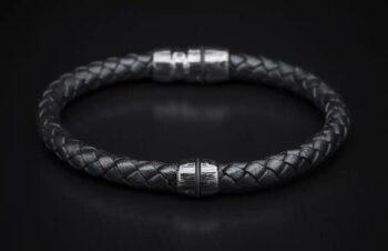 Jupiter bracelet featuring patterned Damascus steel and braided leather band