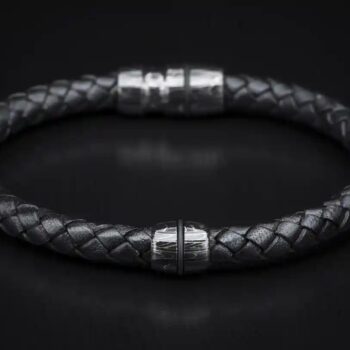 Jupiter bracelet featuring patterned Damascus steel and braided leather band