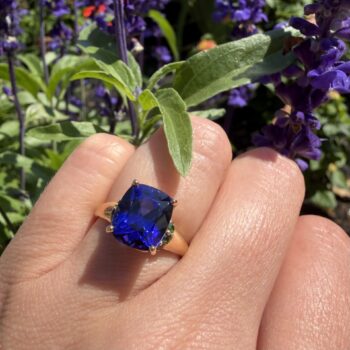 Lyric ring featuring a vibrant colored gemstone set in a fine jewelry band