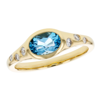 Oval blue topaz ring accented with flush-set diamonds in 14K yellow gold