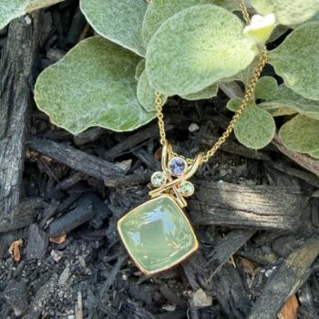 Square prehnite pendant in 14K yellow gold with twisted bail and purple sapphire and peridot accents